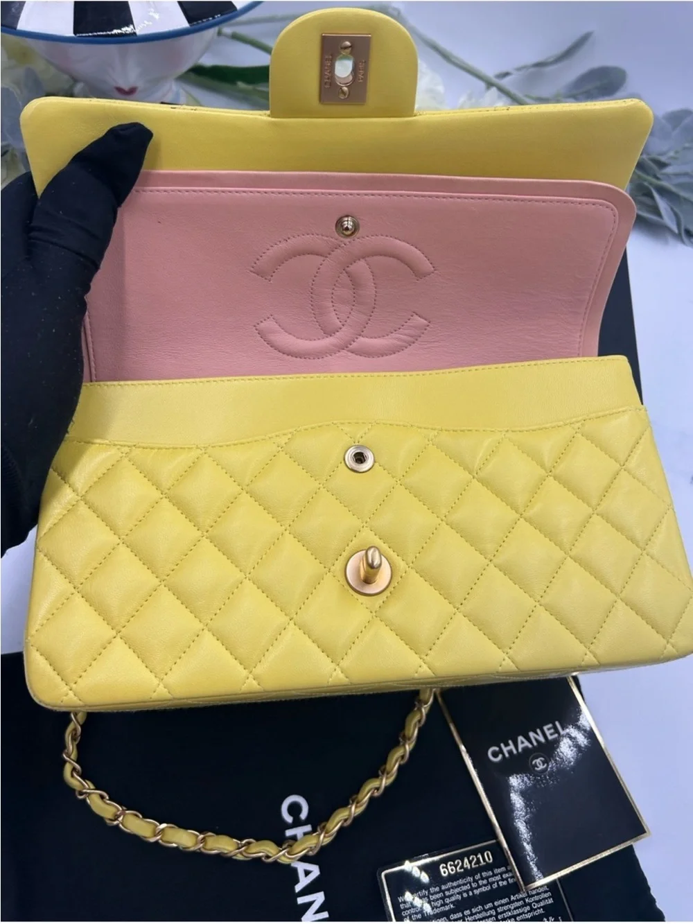 CHANEL CLASSIC QUILTED double flap bag . Yellow with gold hardware .